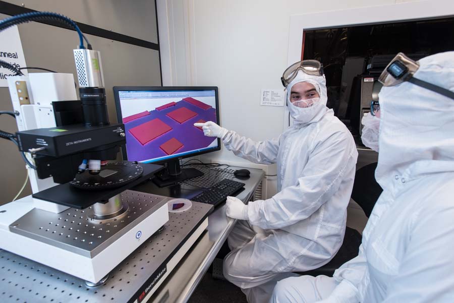 Researchers working at a computer in the Nanotech West Lab cleanroom.