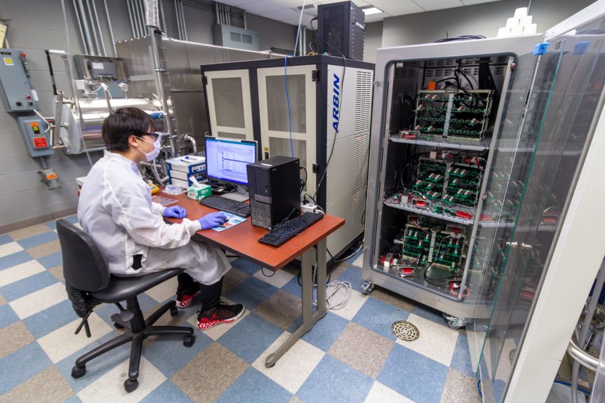 Ohio State student researcher stationed at battery cycling equipment at the Energy Innovation Lab at Nanotech West Lab.