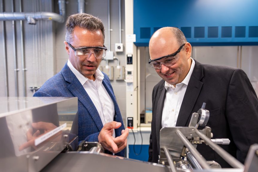 Ohio State's Battery Center acting director Jay Sayre (left) and Tomi Belosevic, President and CEO of next Machinery Group, at Ohio State's Energy Innovation Lab.