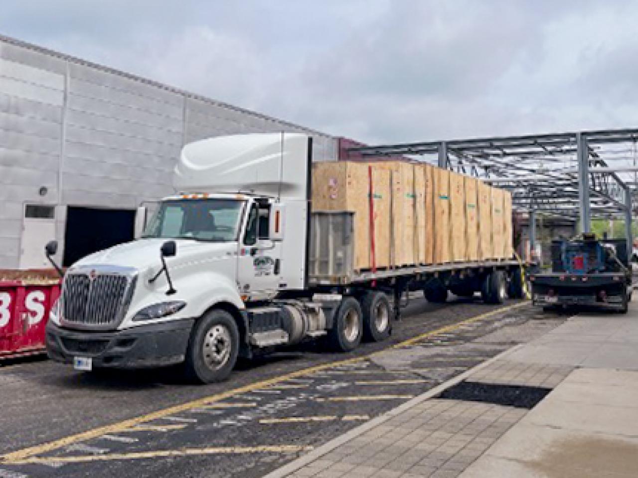 Semi truck delivering a new coater machine to the Battery Center.