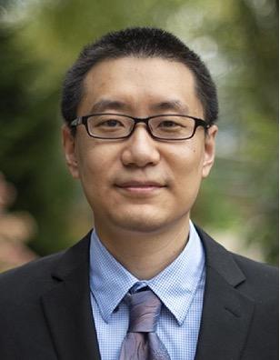 headshot of man in suite