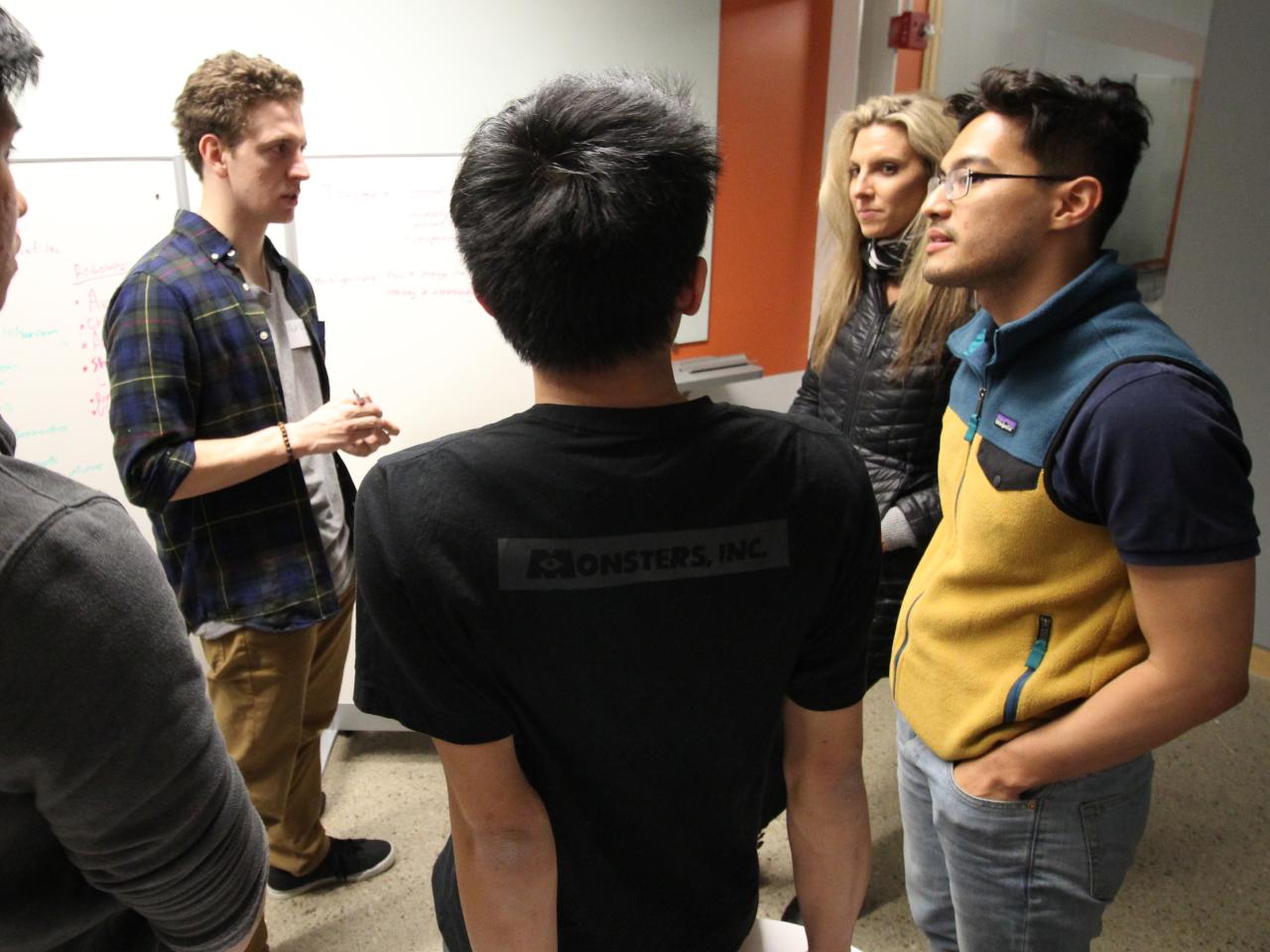 students standing in a group and talking