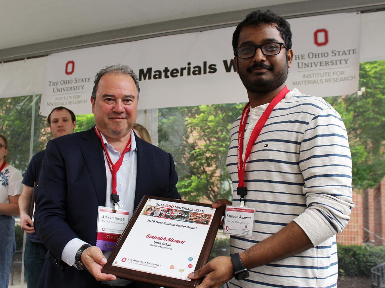 Man being presented with award