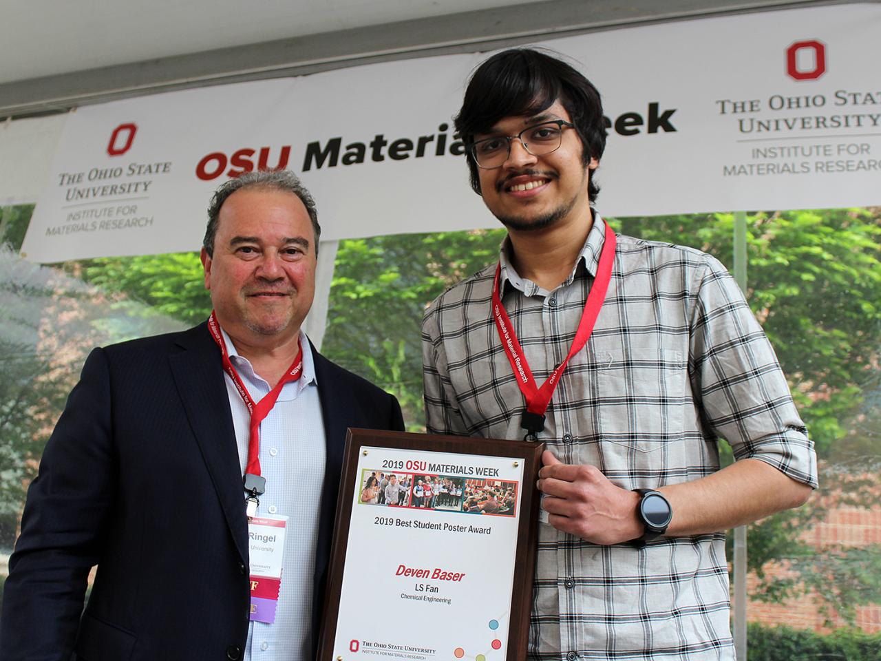 Man being presented with award