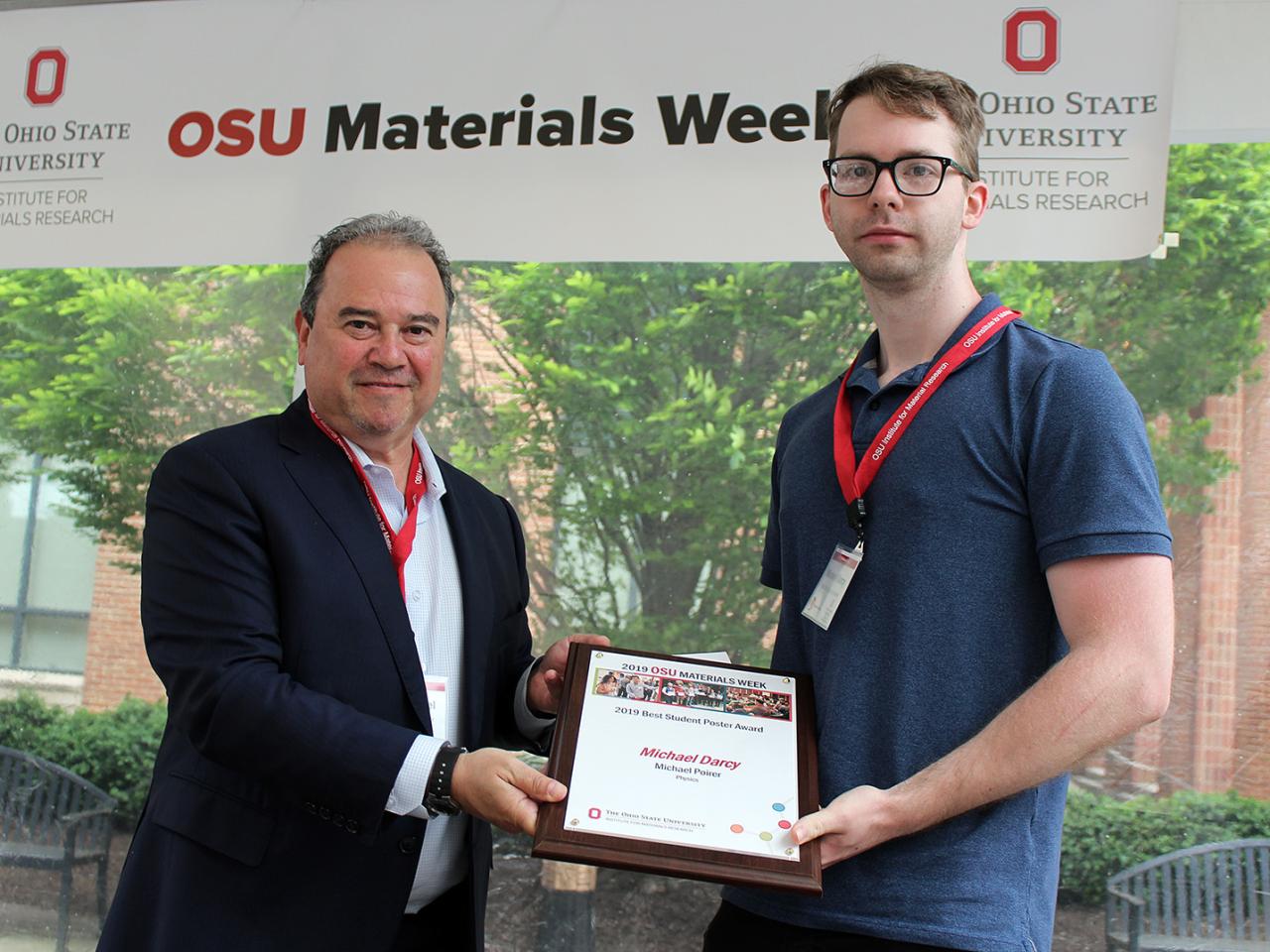 Man being presented with award