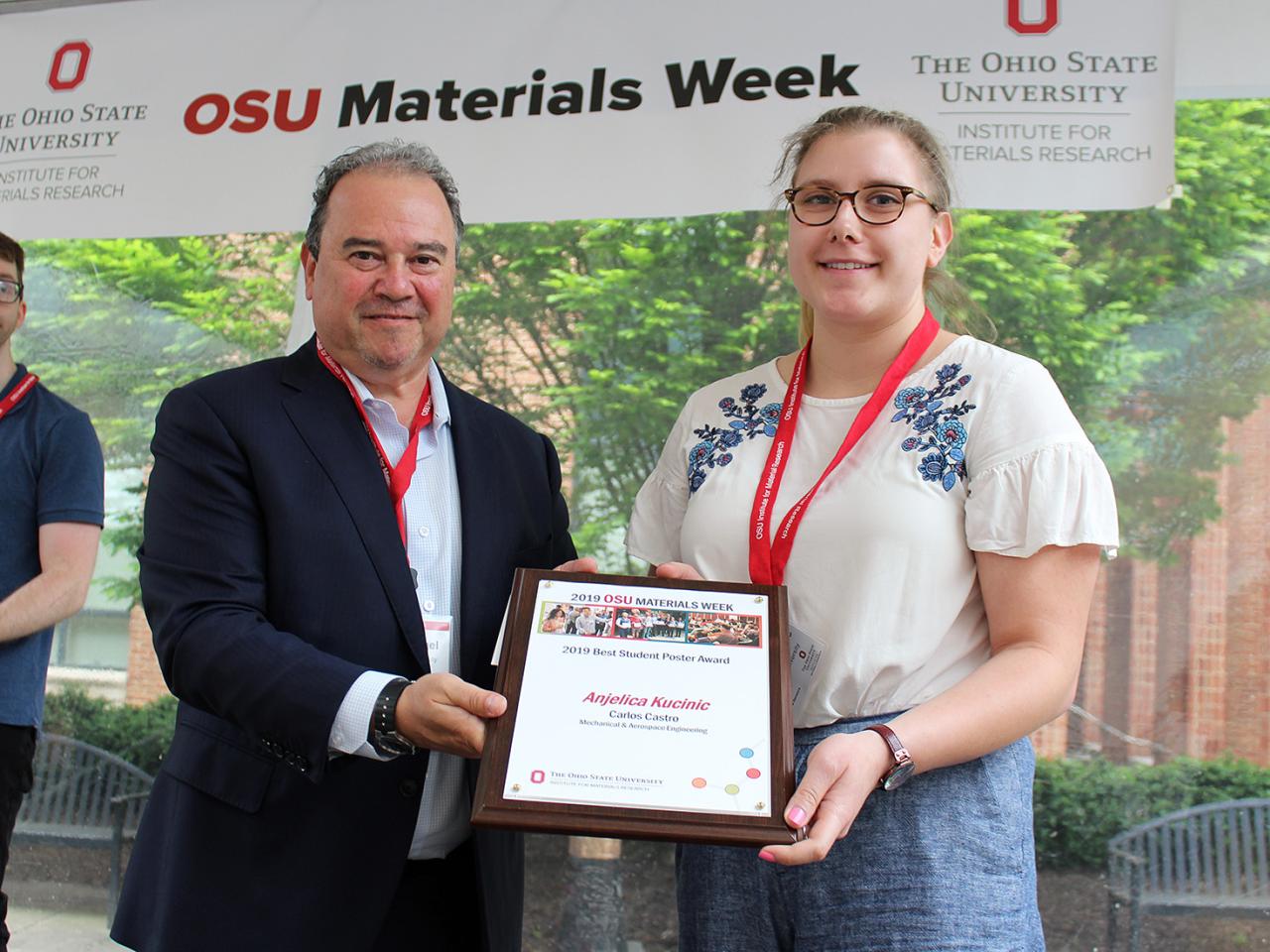 Woman being presented with award