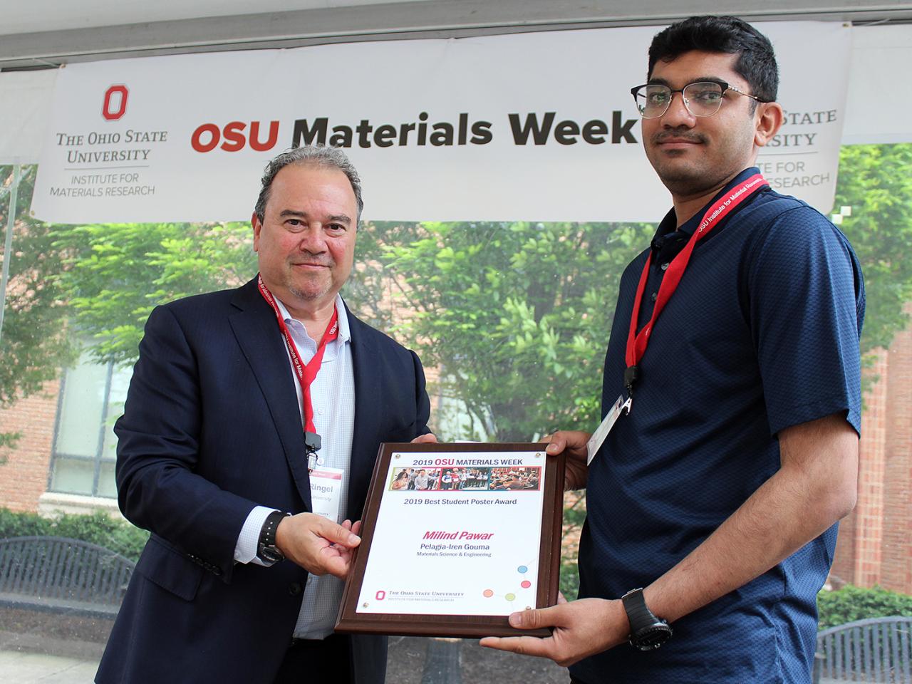 Man being presented with award