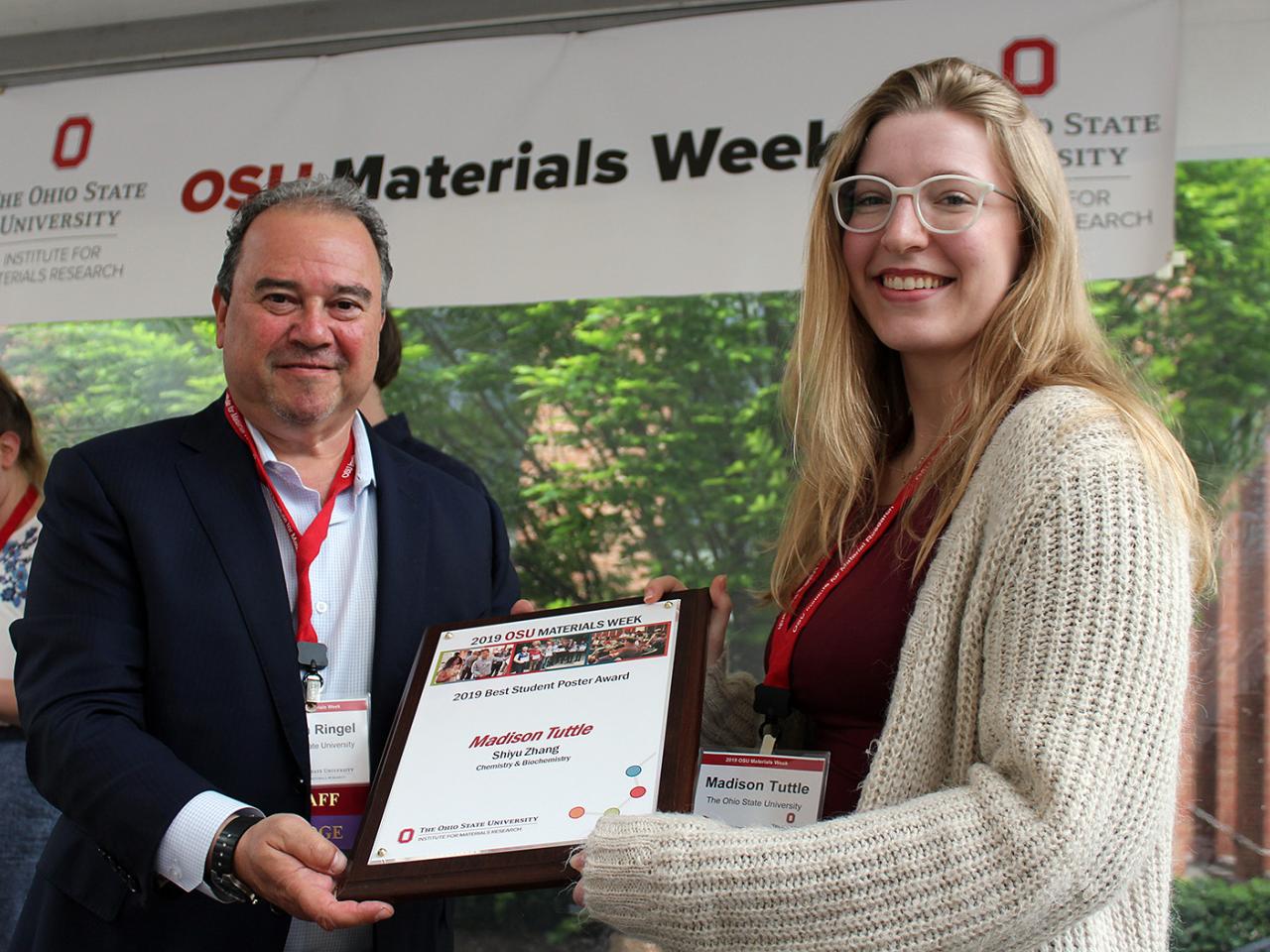 Woman being presented with award