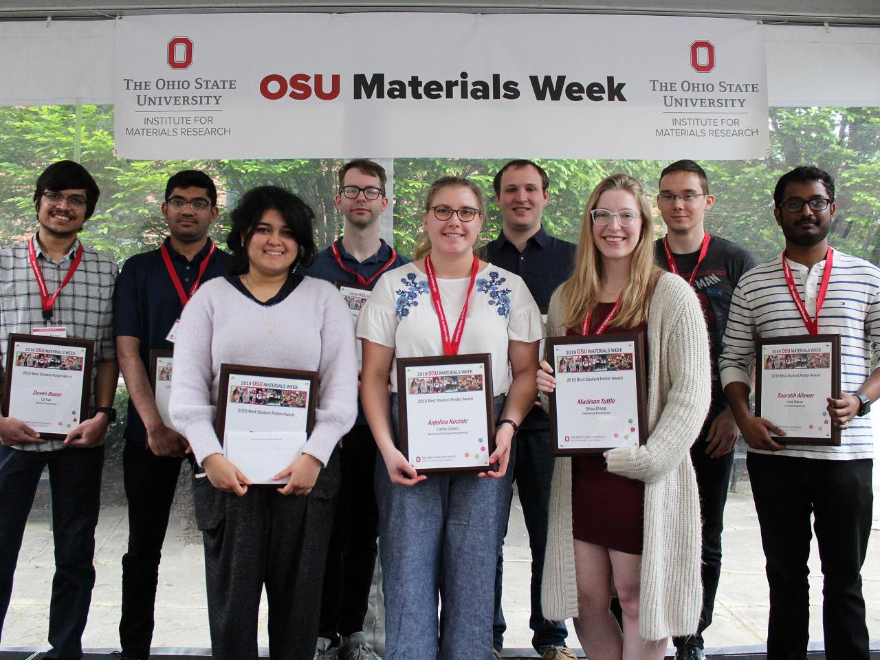 Group of smiling people with awards