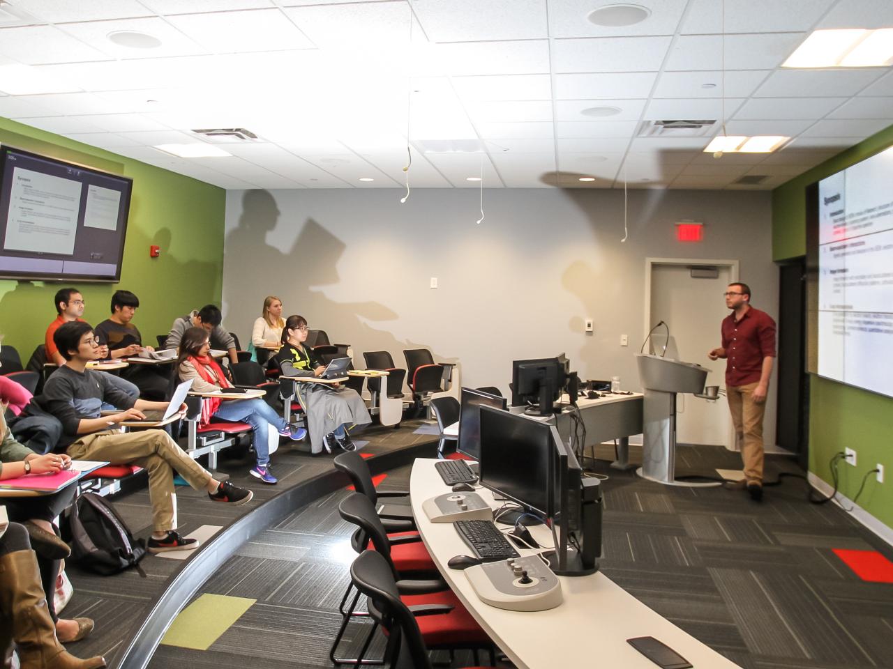 students in a classroom looking at a screen