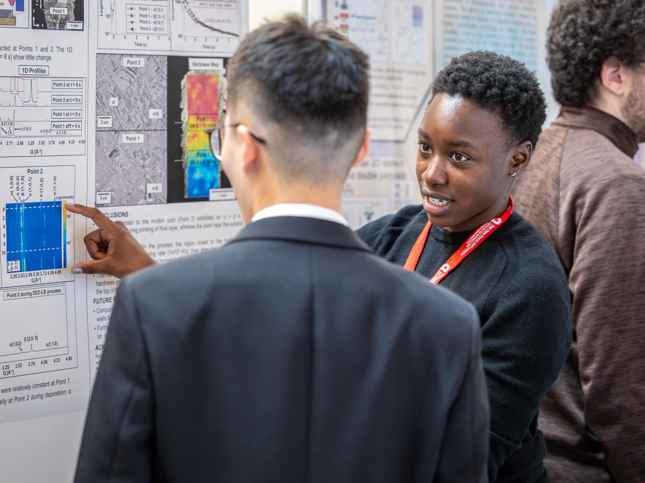 Student presenting a research poster at MMC '26.