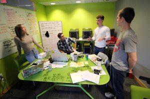 Students in a green room talking