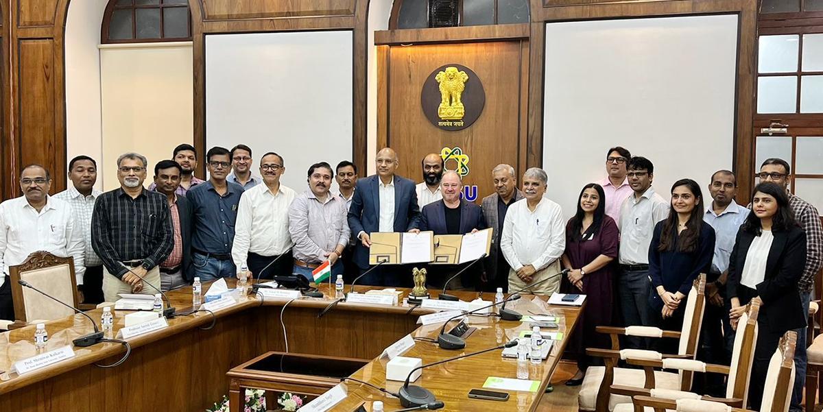 Representatives pose after signing of an agreement to launch an energy technology initiative in India.