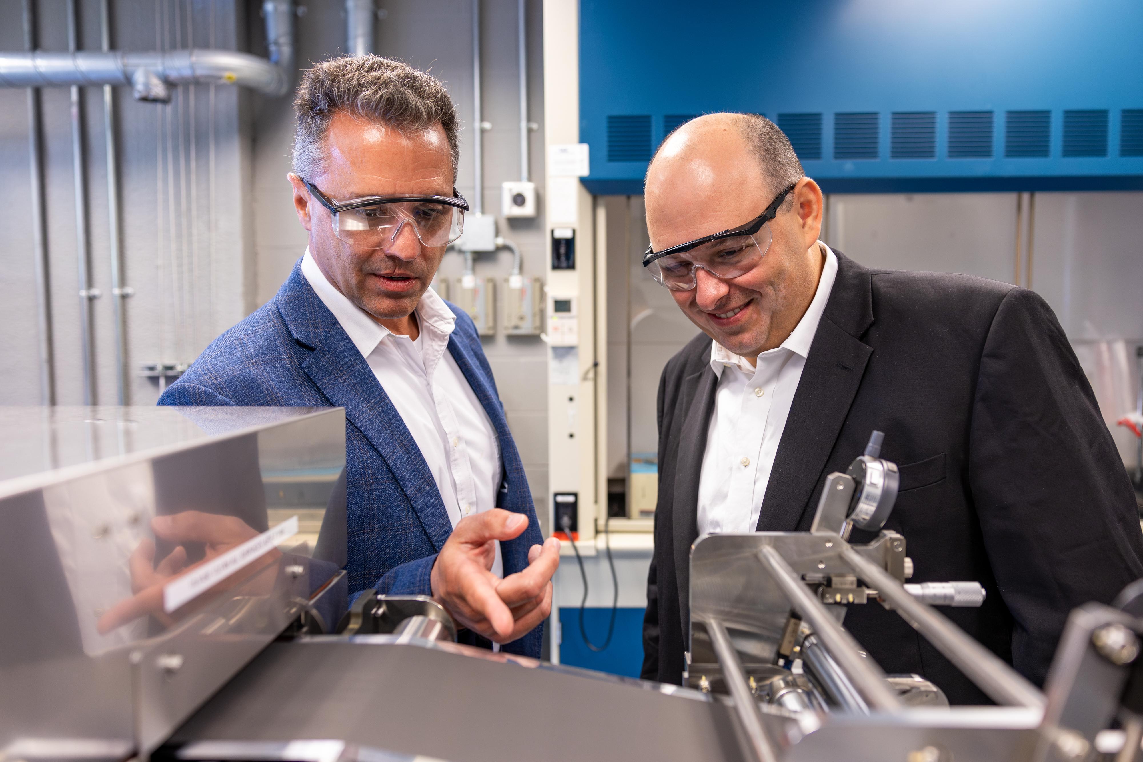 Battery Center acting director Jay Sayre and Tomi Belosevic, the president and CEO of next Machinery Group, Inc., at the Energy Innovation Lab at Nanotech West Lab, Ohio State University.