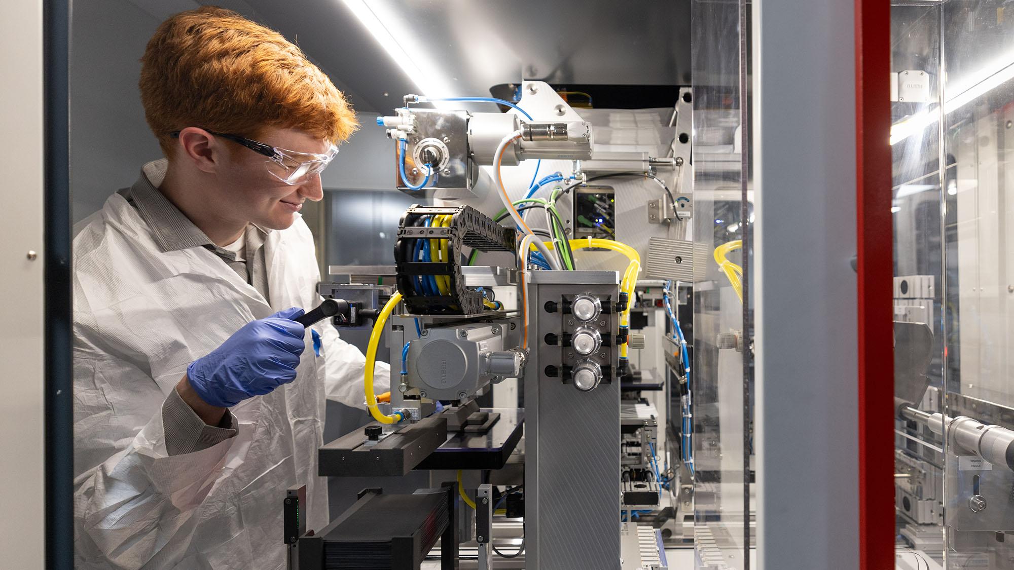 Ohio State engineering student Bennett Kolda works on a developmental battery at Ohio State's Battery Cell Research and Development Center.