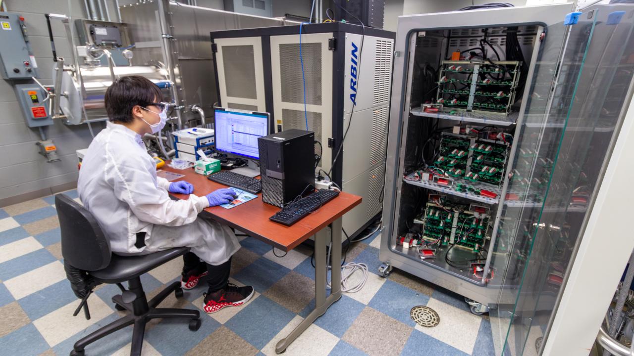 Student testing battery cells at the Energy Innovation Lab.